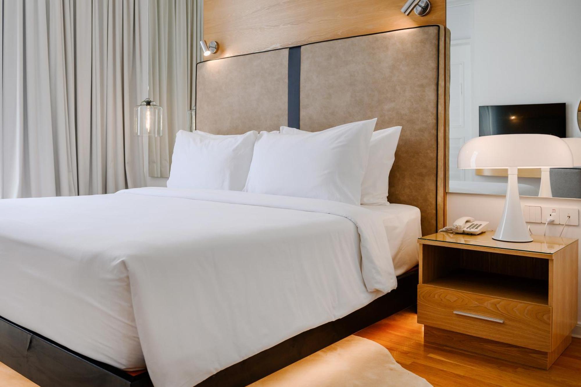 The Riyaz Lavanya Langkawi Pantai Cenang  Exterior photo A bed with a nightstand